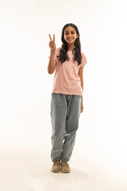 Saudi Girl Victory Sign Standing Against White Background