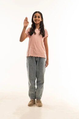 Saudi Girl Performing Scout Salute on White Background