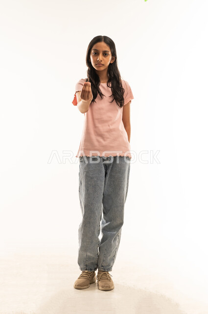 Arab Girl in Studio Making Hand Gesture