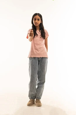 Arab Girl in Studio Making Hand Gesture