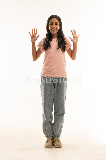 Omani Girl Raising Hands Excitedly on White Background