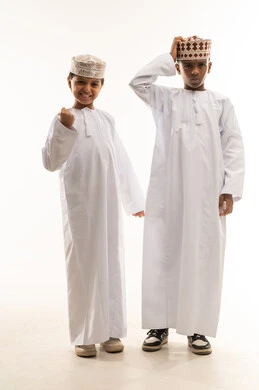 Omani Boys in Traditional Dishdasha and Kumma Studio