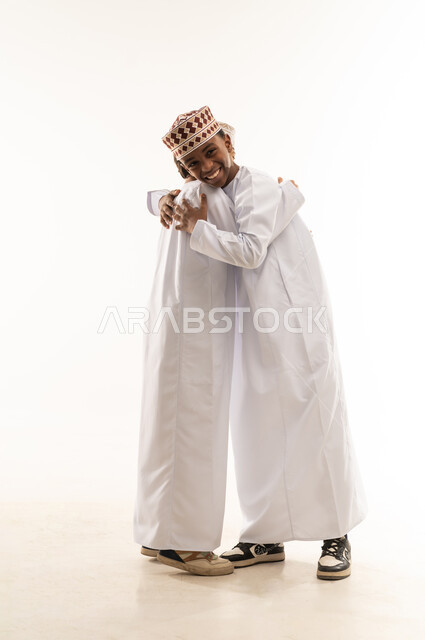 Omani Boys in Traditional Dishdasha Hugging