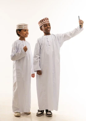 Omani Boys in Traditional Dress Taking Selfie