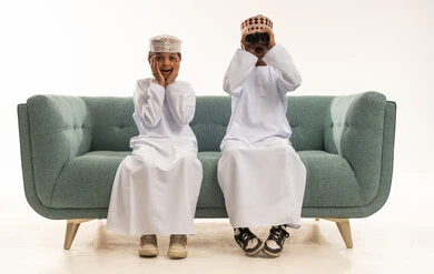 Omani Boys in Traditional Dress with Binoculars