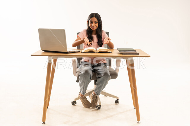 Arab Girl Student at Desk with Laptop and Book