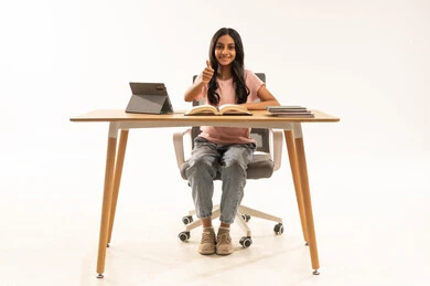 Arab Girl Student Giving Thumbs Up at Desk