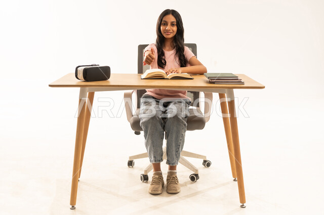 Saudi Girl Student Thumbs Up at Desk with VR