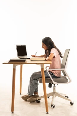 Arab Girl Studying at Desk with Laptop