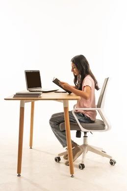 Arab Teenage Girl Studying at Desk with Laptop