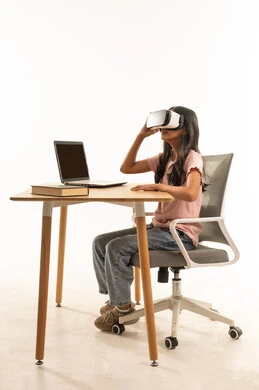 Saudi Girl Using VR Headset at Office Desk