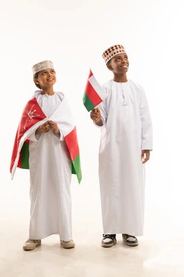 Omani Boys in Traditional Dress with National Flag