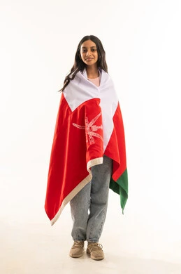 Omani Girl Wrapped in National Flag on White Background
