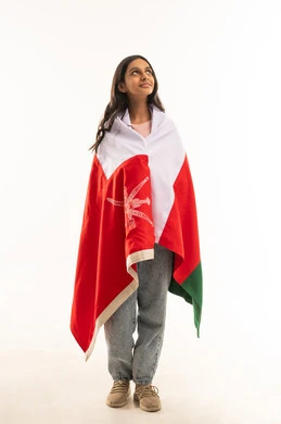 Omani Girl Wrapped in National Flag on White Background