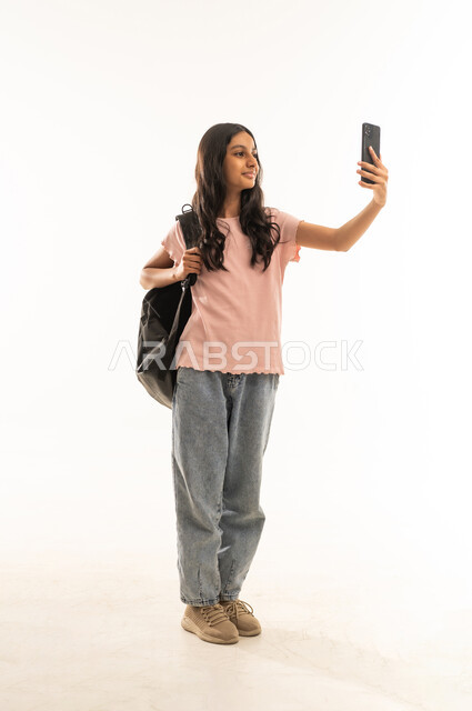 Arab Schoolgirl Taking Selfie with Backpack