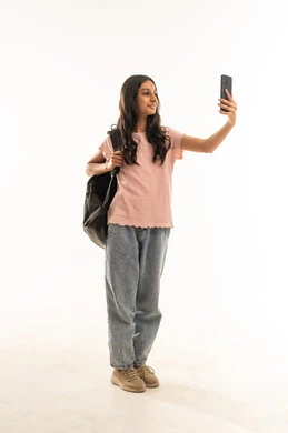 Arab Schoolgirl Taking Selfie with Backpack