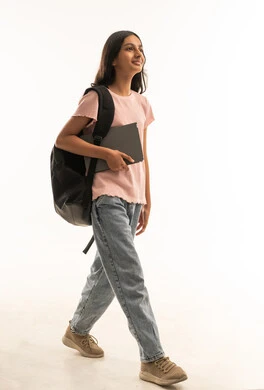 Arab Teenage Student Walking with Backpack and Laptop