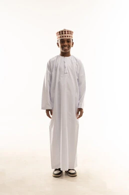 Omani Boy in Traditional Dishdasha and Kumma
