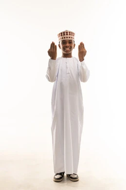 Omani Boy in Traditional Dishdasha Praying on White