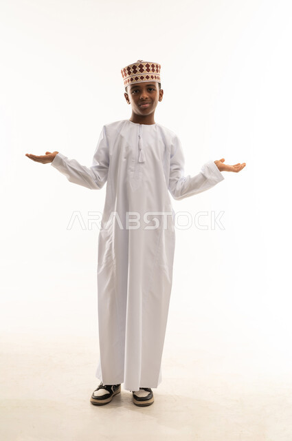 Omani Boy in Traditional Dishdasha and Kumma Studio