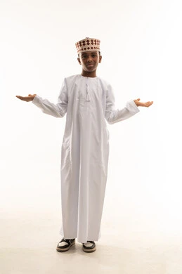 Omani Boy in Traditional Dishdasha and Kumma Studio
