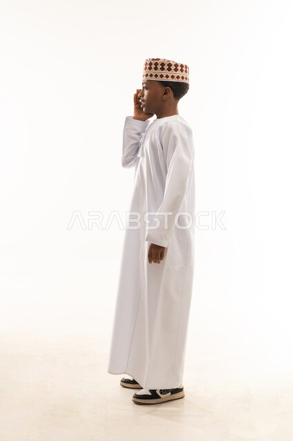 Omani Boy in Traditional Dress on White Background