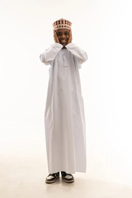 Omani Boy in Traditional Dishdasha and Kummah Omani Boy in Traditional Dishdasha and Kummah