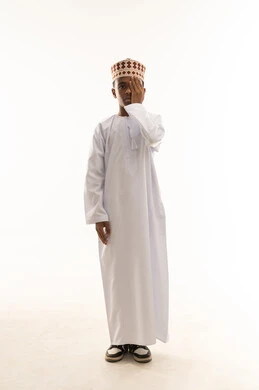 Omani Boy in Traditional Dress on White Background