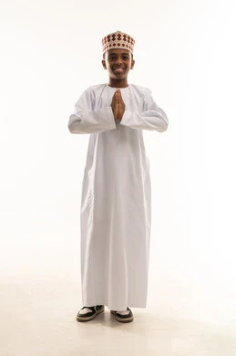 Omani Boy in Traditional Dishdasha Greeting Studio Shot