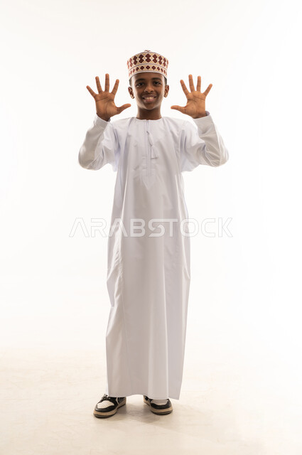 Omani Boy in Traditional Dishdasha Counting Ten