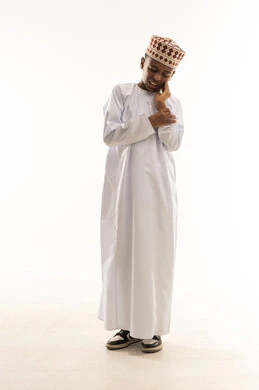Omani Boy with Toothache in Traditional Dress