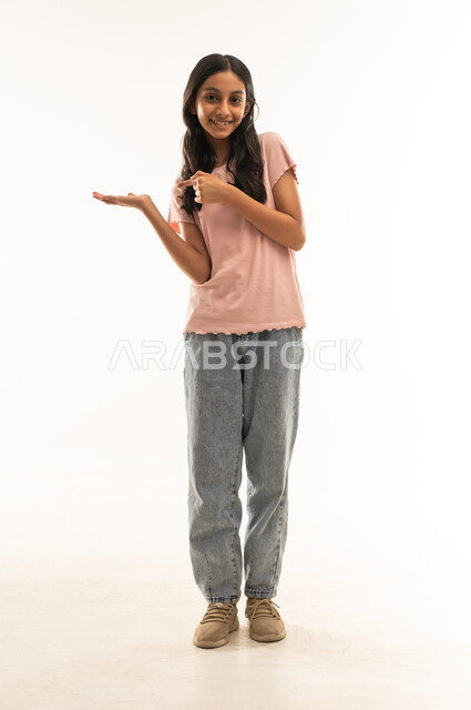 Smiling Omani Girl Pointing Aside on White Background