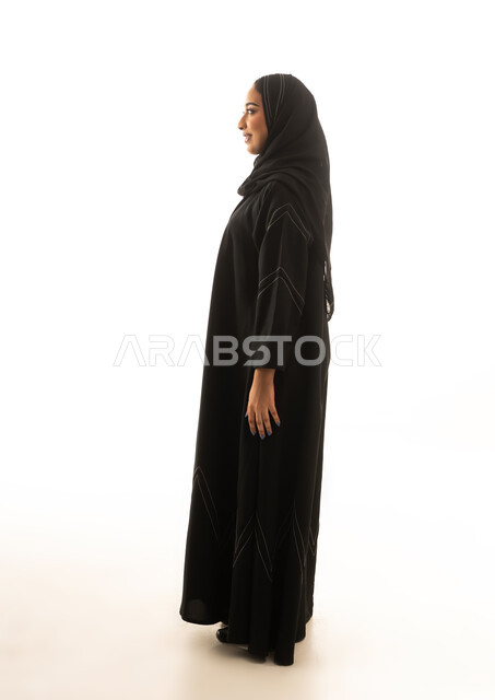 Saudi Woman in Traditional Black Abaya Side Profile View