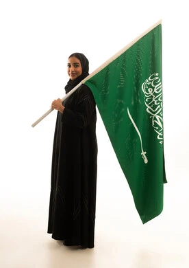 Saudi Woman Holding National Flag on White Background