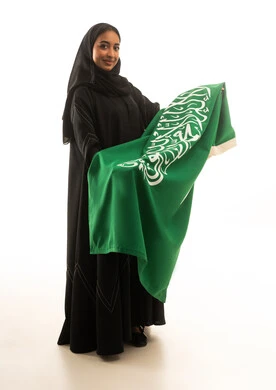 Saudi Woman in Black Abaya Holding National Flag