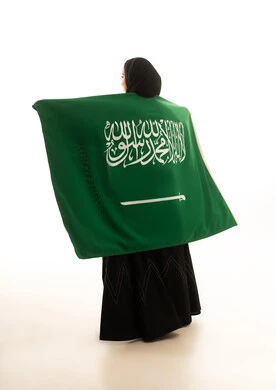 Saudi Woman Holding Flag on White Background