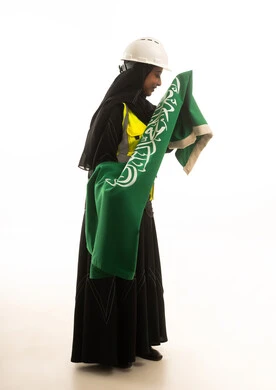 Saudi Female Engineer Holding National Flag on White Background