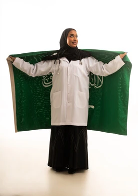Saudi Female Doctor Holding National Flag White Background