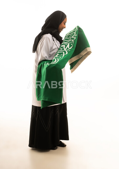 Saudi Female Doctor Holding National Flag White Background