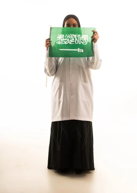 Saudi Female Doctor Holding National Flag on White Background