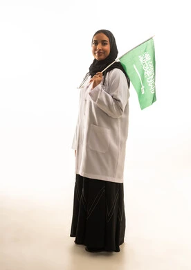 Saudi Female Doctor Holding National Flag White Background