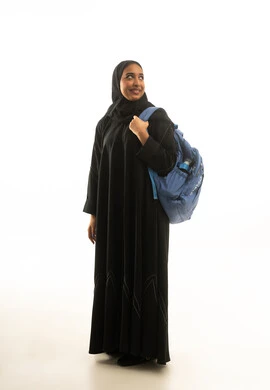 Saudi Female Student in Abaya with Blue Backpack