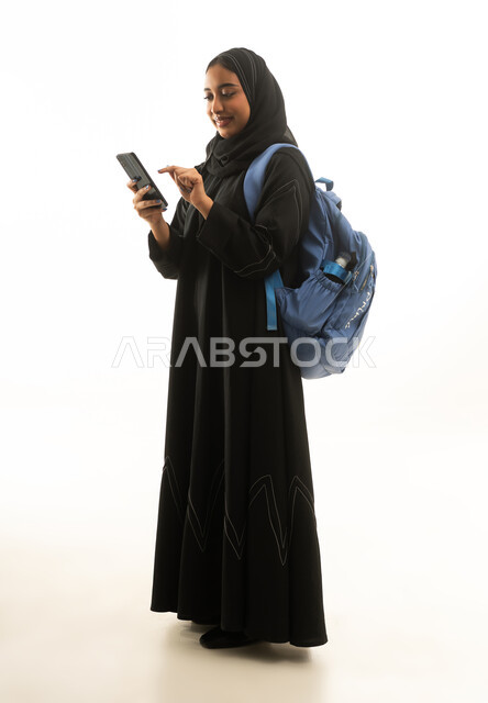 Saudi Female Student with Smartphone and Backpack