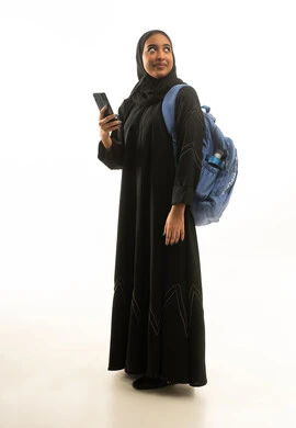 Saudi Female Student with Backpack and Smartphone