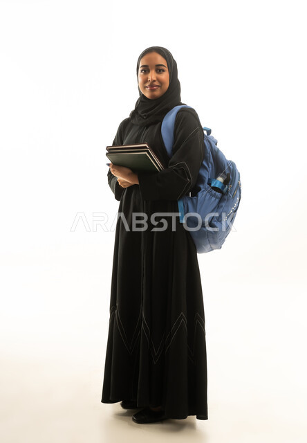 Saudi Female Student with Backpack and Notebooks on White