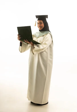 Saudi Female Graduate in White Gown Holding Diploma