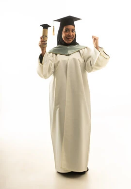 Saudi Female Graduate in White Gown Celebrating Success