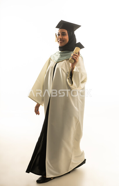 Saudi Female Graduate Walking with Diploma