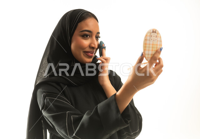 Saudi Woman in Black Abaya Applying Makeup