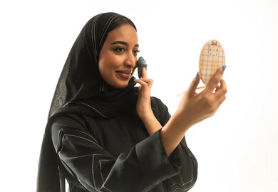 Saudi Woman in Black Abaya Applying Makeup